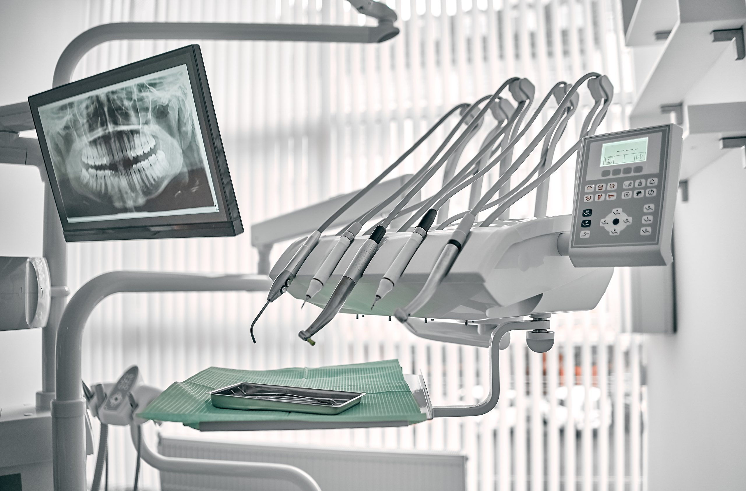 Stomatological instrument in the dentists clinic. Dental work in clinic. Operation, tooth replacement. Medicine, health, stomatology concept. Office where dentist conducts inspection and concludes.